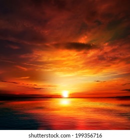 abstract nature background with red sunset and ocean