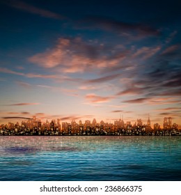 abstract nature blue background with panorama of city and brown clouds