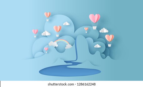 Abstract of nature landscape view scene with cloud, pond, rainbow and heart shape hot air balloons float up on sky. paper cut for valentine's day. paper cut and craft style. vector, illustration.