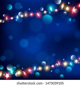 Abstract of night string lights on dark blue background along with tiny bokeh,Fairy lights are consist of red,blue and yellow color