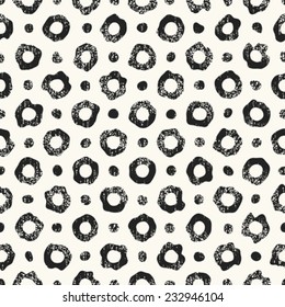Abstract noisy textured dot and ring leopard background. Seamless pattern. Vector.
