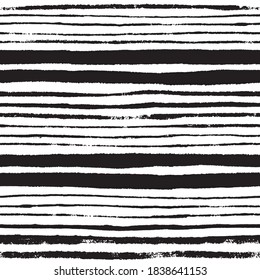 Abstract noisy textured striped background. Seamless pattern with hand painted grunge ink doodles in black and white. Vector.