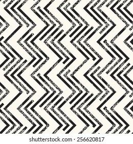 Abstract noisy textured zigzag background. Seamless pattern. Vector.
