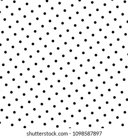 Abstract oblique pattern with polka dots. Vector background. Black small circles arranged in alternating inclined rows. Modern white dotted background in retro style. Equal intervals between points.