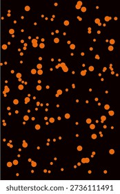 Abstract orange bokeh dots on black background.