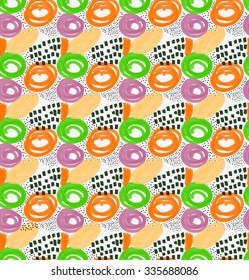 Abstract orange green and purple circles with black dots.Hand drawn with paint brush seamless background.Modern hipster style design.