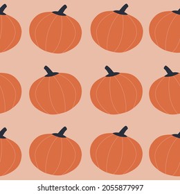 Abstract orange pumpkins hand drawn vector illustration. Seasonal vegetables harvest on a pink background. Colorful Halloween print. Autumn seamless pattern.