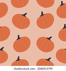 Abstract orange pumpkins on a pink background. Seasonal vegetables harvest hand drawn vector illustration. Colorful Halloween print. Autumn seamless pattern.