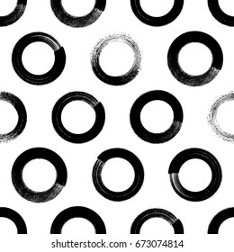 Abstract paint brushstroke circles seamless background. Black and white hand drawn pattern.
