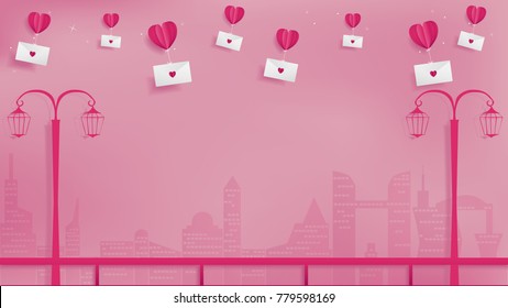 Abstract paper craft of valentines conception contains red paper balloon heart taking love mail flying over the skyscraper along a side walk ,soft pink background ,side walking with street lamp