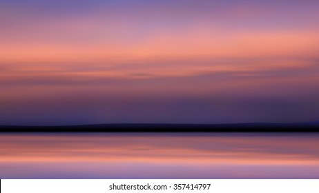 Abstract pastel  scene of clouds over calm  waters just  after sunset. 