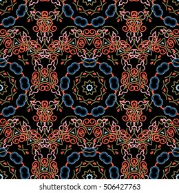 Abstract pattern in Arabian style. Seamless vector background. Blue and orange texture on black background. Graphic modern pattern.