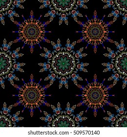 Abstract pattern in Arabian style. Seamless vector background. Blue and orange texture on black background. Graphic modern pattern.