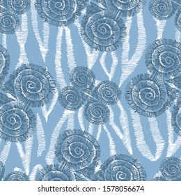 Abstract pattern of elongated and spiral shapes. Blue and white zigzag lines on a blue background. The lines are made by hand with ink. Seamless pattern.

