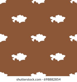 abstract pattern filled with maps of kazakhstan. white silhouettes on brown background