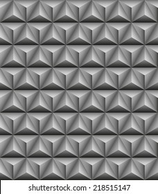 Abstract pattern of gray stone tripartite pyramids. Seamless texture