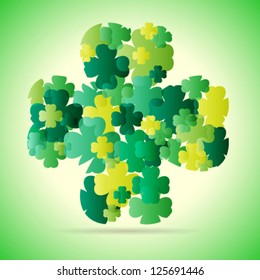 Abstract pattern with sliced four leaf clover on green background