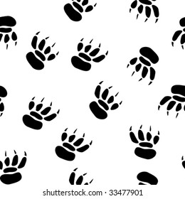Abstract pawprint background. Seamless. Black-and-white palette. Vector illustration.