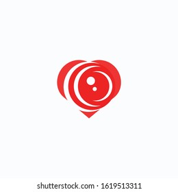 Abstract photo camera lens inside heart. Vector logo icon template. Design concept for wedding photographer. 