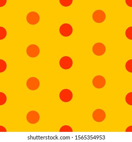 Abstract polka dot seamless pattern. Red and orange circles on yellow background