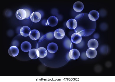 Abstract purple or blue background. Blurred purple or blue bokeh effect on dark background consist of glowing defocused circles and rounded transparent shapes. 