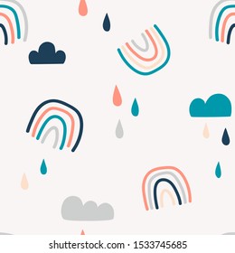 Abstract rainbows hand drawn seamless pattern. Colorful uneven geometric shapes doodle drawing. Rain drops clouds background. Gender neutral nursery backdrop. Decorative textile, wallpaper, wrapping