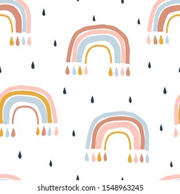 Abstract rainbows hand drawn seamless pattern. Colorful uneven geometric shapes doodle drawing. Rain drops background. Gender neutral nursery backdrop. Decorative textile, wallpaper, wrapping paper