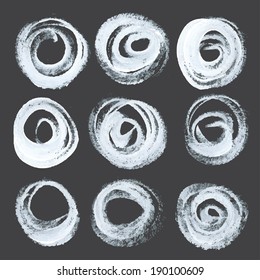 Abstract realistic round strokes drawn thick white paint on black paper