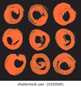 Abstract realistic round strokes drawn thick orange paint on black paper big set
