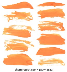 Abstract realistic smears orange gouache paint on white paper 1