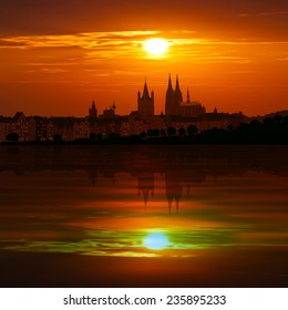 abstract red background with clouds and silhouette of Koln