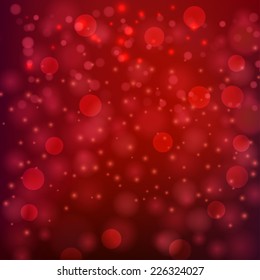 Abstract red background with glitter lights . Sparkling fantasy dream background. Christmas background with blur bokeh lights
