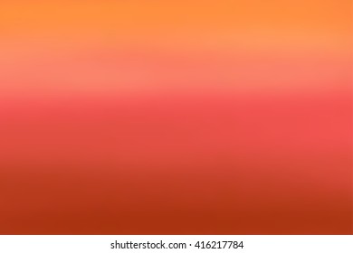 Abstract red and orange blurred background. Colorful gradient backdrop for web design or screen wallpaper