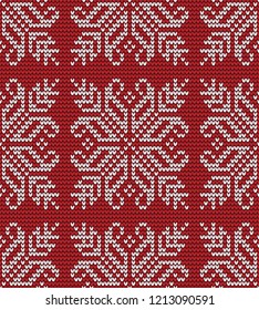Abstract red and white seamless knitting pattern with snowflake background