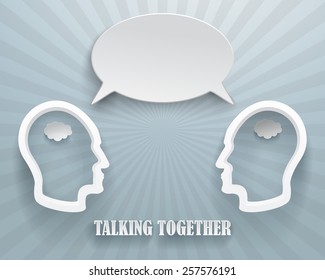 Abstract representation of a talking workgroup. Two heads with speech bubble on a blue background.