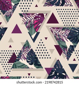 Abstract retro seamless pattern with tropical palm leaves and textured triangles.  Vector illustration.
