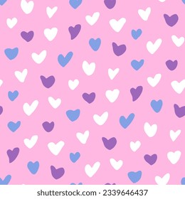 Abstract romantic seamless pattern with tender hearts on light pink background. Cute hand drawn print. Ornament for girlish textile products design, womenswear. Festive wallpaper for valentine's day.