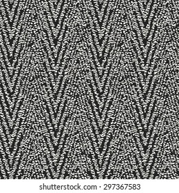 Abstract rough woven effect chevron motif. Seamless pattern.