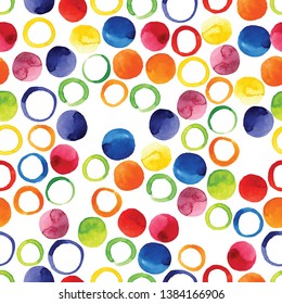 Abstract round watercolor patterns
made by brush on paper. Seamless texture of multicolored circles.