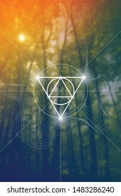 Abstract sacred geometry interlocking geometric shapes design template on colorful forest background