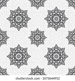 Abstract seamless backdrop. Design for prints, textile, decor, fabric. Round colorful texture in gray and white colors. Mandala background