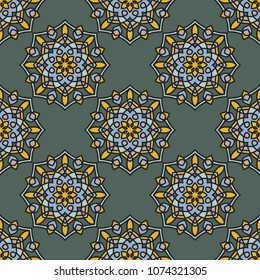 Abstract seamless backdrop. Design for prints, textile, decor, fabric. Round colorful texture in green, blue and yellow colors. Mandala background