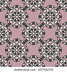 Abstract seamless backdrop. Design for prints, textile, decor, fabric. Round colorful texture in green and rose colors. Mandala flower background