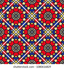 Abstract seamless backdrop. Round colorful texture in red, yellow and blue colors. Mandala background. Tile pattern