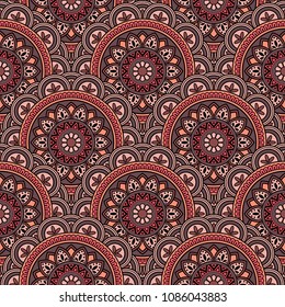 Abstract seamless backdrop. Round colorful texture in red and black colors. Mandala background