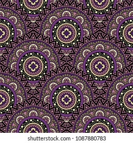 Abstract seamless backdrop. Round colorful texture in violet and yellow colors. Mandala background. Oriental pattern for design