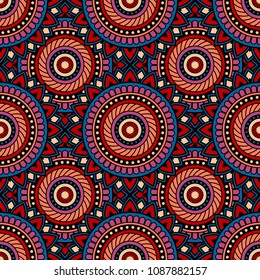 Abstract seamless backdrop. Round colorful texture in red, blue and violet colors. Mandala background. Oriental pattern for design