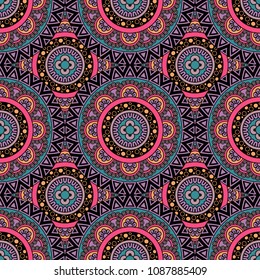 Abstract seamless backdrop. Round colorful texture in violet, blue and pink colors. Mandala background. Oriental pattern for design