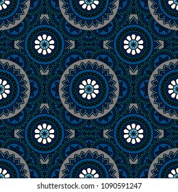 Abstract seamless backdrop. Round colorful texture in blue, black and white colors. Mandala background. Oriental pattern for design