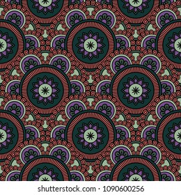 Abstract seamless backdrop. Round colorful texture in green, violet and red colors. Mandala background. Oriental pattern for design